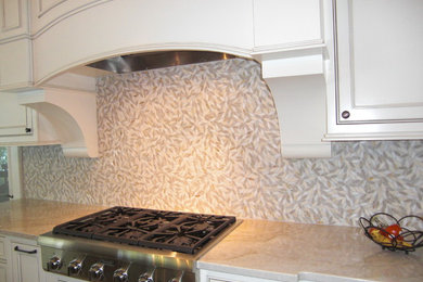 Inspiration for a transitional kitchen remodel in Atlanta with white cabinets, multicolored backsplash and stone tile backsplash