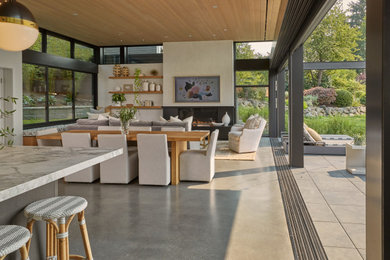 Dining room - modern concrete floor and wood ceiling dining room idea in Seattle