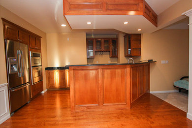 Home bar - transitional home bar idea in Detroit