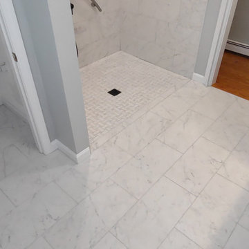 Replaced wood floor with a tile floor with zero treshold shower