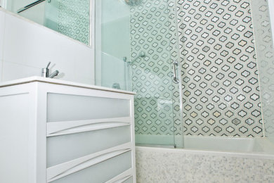 Bathroom - mid-sized contemporary 3/4 black tile and glass tile marble floor and beige floor bathroom idea in New York with glass-front cabinets, white walls, white cabinets, an undermount sink and quartz countertops