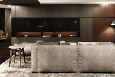 Example of a large trendy open concept dark wood floor and brown floor living room design in Other with gray walls, no fireplace and a wall-mounted tv