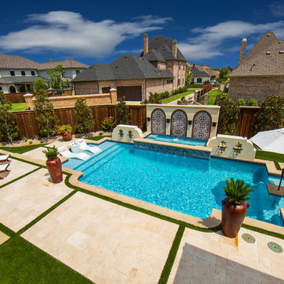 Mid-sized tuscan home design photo in Dallas