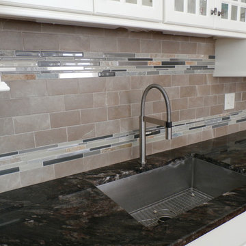 Traditional White Kitchen Remodel with Cook top in the peninsula