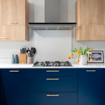Fresh, contemporary and colourful renovation including blue bespoke kitchen and