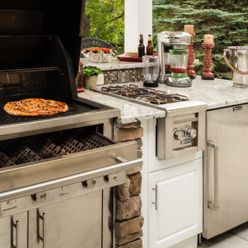 Luxurious White Outdoor Kitchen - Accented by Stone
