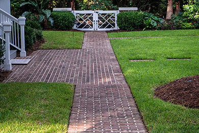 Design ideas for a huge traditional partial sun brick landscaping in Charleston for spring.