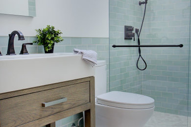 Bathroom - small coastal 3/4 blue tile and ceramic tile marble floor, beige floor and single-sink bathroom idea in Other with flat-panel cabinets, distressed cabinets, a two-piece toilet, white walls, a console sink, white countertops, a niche and a freestanding vanity