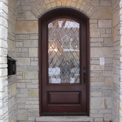 Stone Arched Doorway with Mahogany Wood Front Door - Front Doors