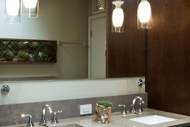 Mid-sized trendy master multicolored tile and pebble tile porcelain tile alcove shower photo in Chicago with recessed-panel cabinets, dark wood cabinets, gray walls, an undermount sink and quartz countertops