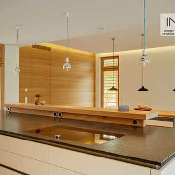 Kitchen in crisp white and mellow wood.