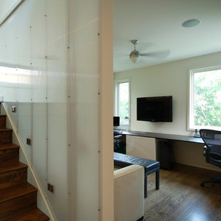Design ideas for a modern home office and library in Minneapolis with white walls and dark hardwood flooring.