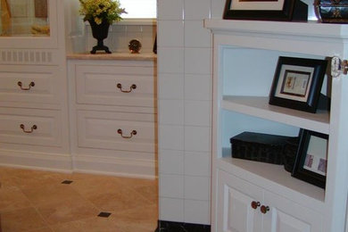 Mid-sized elegant master limestone floor and beige floor bathroom photo in Minneapolis with raised-panel cabinets, white cabinets and beige walls