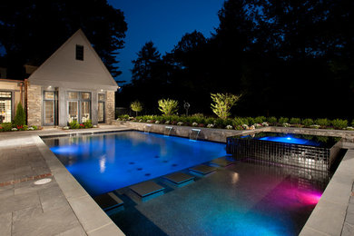 Design ideas for a large contemporary backyard rectangular pool in Other with a hot tub.