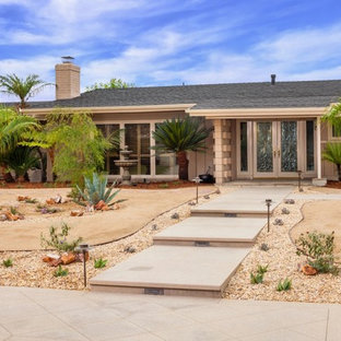 Large and desert look front yard full sun xeriscape in Orange County with concrete pavers.