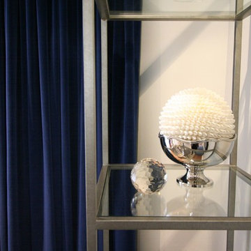 LIVING ROOM blue velvet curtains and silver accessories