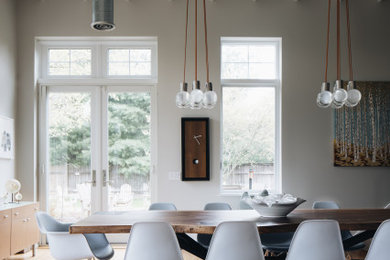 Large 1960s light wood floor and wood ceiling great room photo in Grand Rapids with gray walls