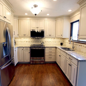 Cream Painted Waypoint Cabinets with Granite Countertops