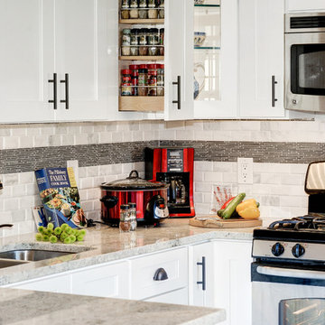White Kitchen Remodel with Colonial White Granite and Stainless Steel Appliances