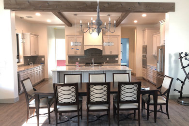 Large cottage u-shaped medium tone wood floor eat-in kitchen photo in Austin with an undermount sink, shaker cabinets, white cabinets, granite countertops, gray backsplash, porcelain backsplash, stainless steel appliances, an island and gray countertops
