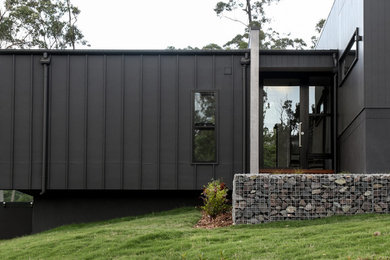 Photo of a modern entryway in Sunshine Coast with black walls.
