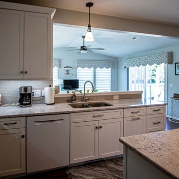 White Shaker Kitchen w/ Pietra Quartz Countertop and Gray Subway Tile Backsplash