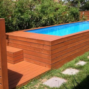 他の地域の巨大な長方形トラディショナルスタイルのおしゃれなプール (天然石敷き) の写真