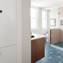 Nice half wall with glass in shower lets light in, tucked in toilet get