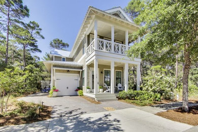 This is an example of a coastal full sun front yard landscaping in Other for spring.
