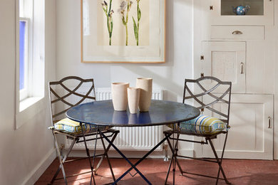 Kitchen/dining room combo - mid-sized southwestern kitchen/dining room combo idea in Albuquerque with white walls and no fireplace