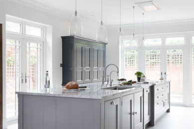 Design ideas for a large traditional kitchen in Hampshire with recessed-panel cabinets, grey cabinets, marble benchtops and grey benchtop.