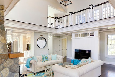 Inspiration for a large coastal open concept and formal dark wood floor living room remodel in Boston with white walls, a stone fireplace and a standard fireplace