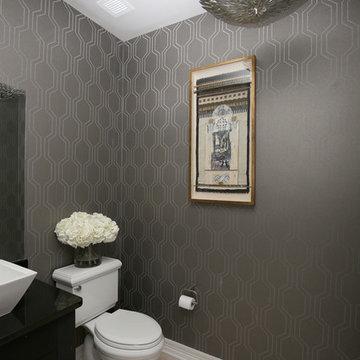 Geometric patterned wallpaper with a silver beaded texture