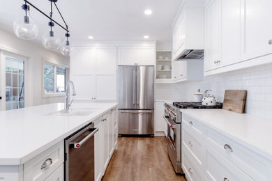 Example of a transitional kitchen design in Vancouver