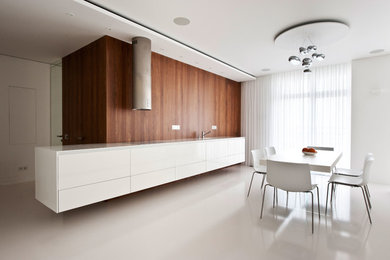 Contemporary single-wall open plan kitchen in Moscow with flat-panel cabinets, white cabinets and no island.