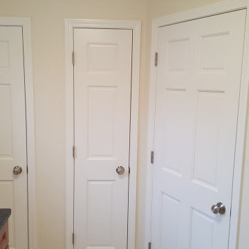 Laundry room...left door=broom closet, center=linen closet rear door, right=hall