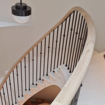 Oak handrail on a stone staircase