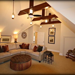 Inspiration for a large timeless enclosed carpeted home theater remodel in Charlotte with beige walls and a wall-mounted tv