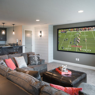 This is an example of a medium sized farmhouse home cinema in Wichita with white walls, carpet, a projector screen and grey floors.