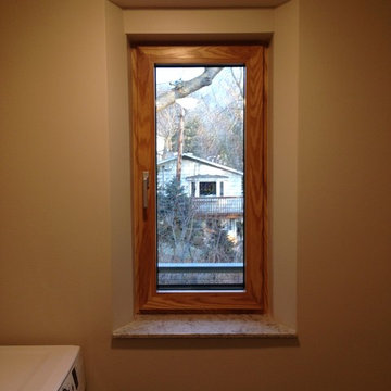 Laundry window with quartz sill and tapered drywall returns