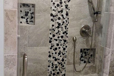 Example of a mid-sized trendy 3/4 multicolored tile and pebble tile alcove shower design in Other