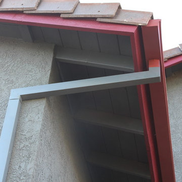 Seamless Box Style Gutters, Colonial Red, Storm Gray Downspouts