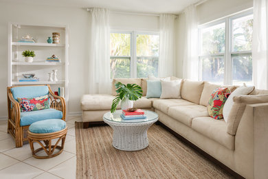 Small beach style open concept living room in Orlando with white walls, ceramic floors and beige floor.