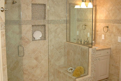 Corner shower - mid-sized white tile and ceramic tile ceramic tile corner shower idea in Denver with raised-panel cabinets and beige walls
