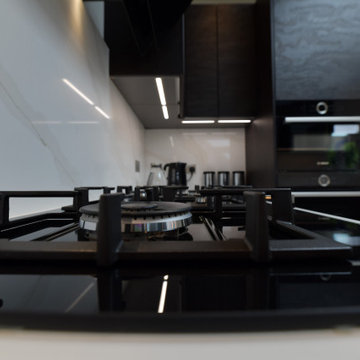 Black and white compact kitchen with elegant design and funtional element