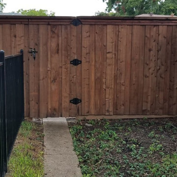 Cedar Board on Board with Wrought Iron Fence
