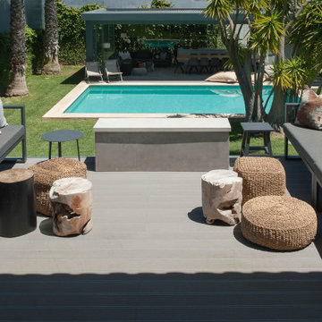 Birre terrace with outdoor sofas and pool view