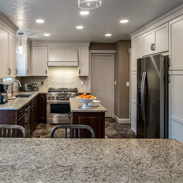 Two Tone Kitchen White Cabinets with Wood Island with Granite Countertop