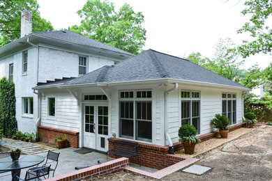 Photo of a traditional home design in Raleigh.