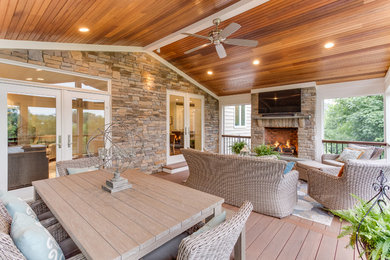 Inspiration for a timeless back porch remodel in Baltimore with a fire pit